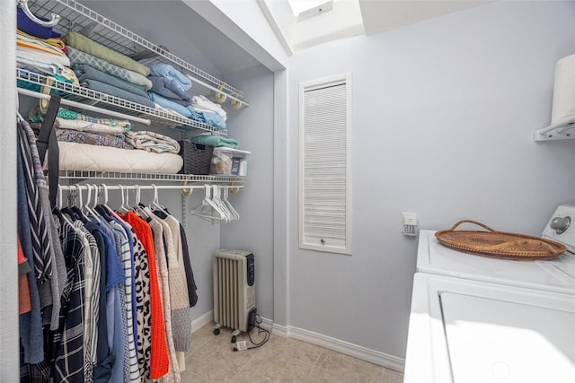 2877N Nugent Rd Unit M4, Lummi Island, WA 98262 - washroom with independent washer and dryer, radiator heating unit, baseboards, and tile patterned flooring