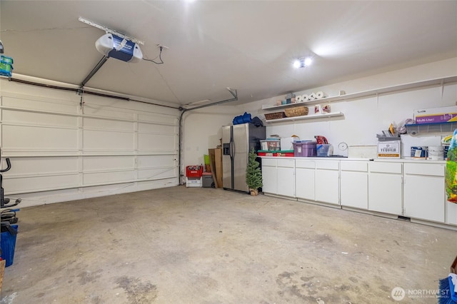 2877N Nugent Rd Unit M4, Lummi Island, WA 98262 - garage featuring stainless steel fridge and a garage door opener