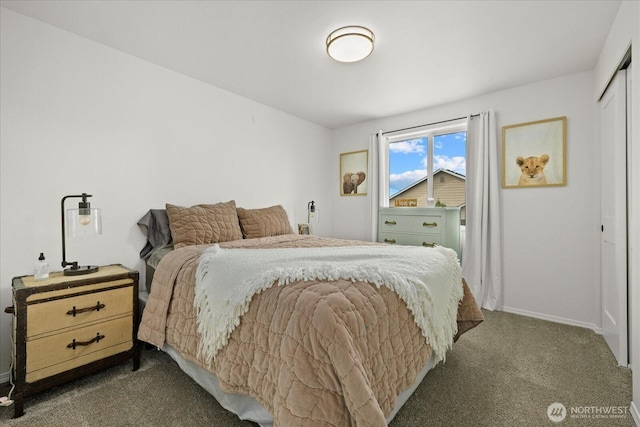 17726 83rd Dr NE, Arlington, WA 98223 - bedroom with dark colored carpet, a closet, and baseboards