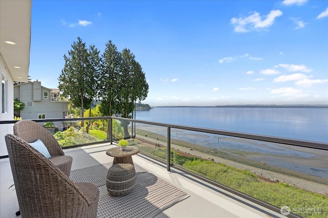 balcony featuring a water view