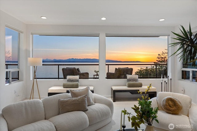 interior space featuring recessed lighting and a water view