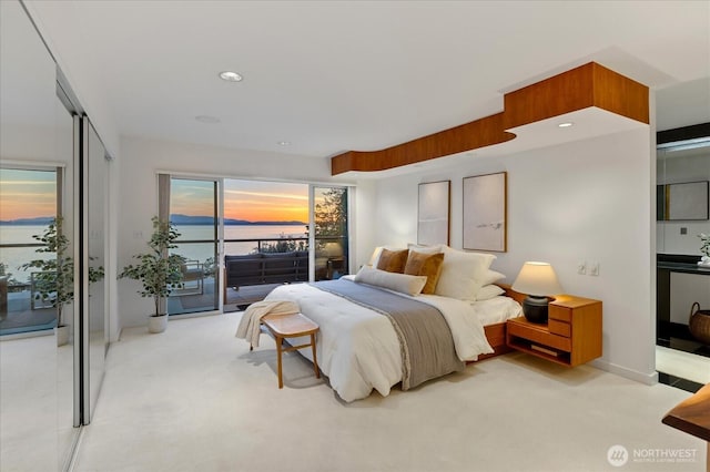 bedroom featuring carpet floors, access to outside, and recessed lighting