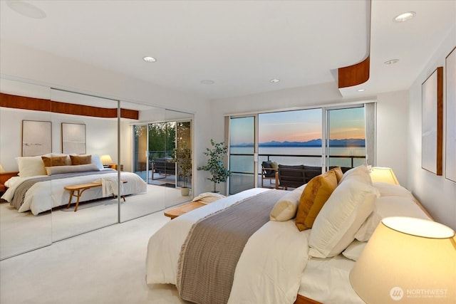 bedroom featuring recessed lighting, carpet, and access to exterior