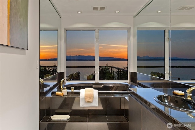 bathroom with vanity, tile patterned flooring, and visible vents
