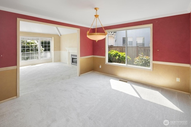 23812 21st Dr SE, Bothell, WA 98021 - spare room with crown molding, visible vents, carpet, and a fireplace