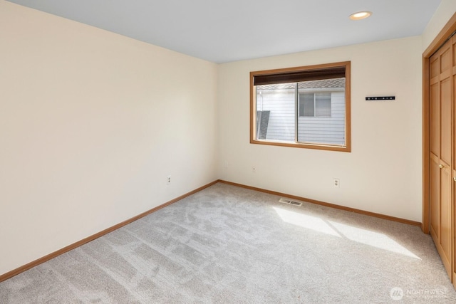23812 21st Dr SE, Bothell, WA 98021 - unfurnished bedroom featuring visible vents, a closet, baseboards, recessed lighting, and light colored carpet
