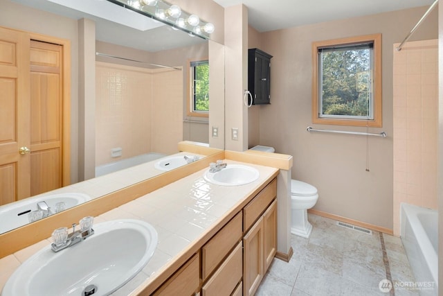 23812 21st Dr SE, Bothell, WA 98021 - full bath with visible vents, a sink, and shower / tub combination