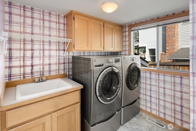 23812 21st Dr SE, Bothell, WA 98021 - washroom featuring a sink, washer and dryer, and wallpapered walls