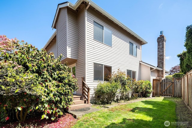 23812 21st Dr SE, Bothell, WA 98021 - back of property featuring a lawn, fence, and a gate