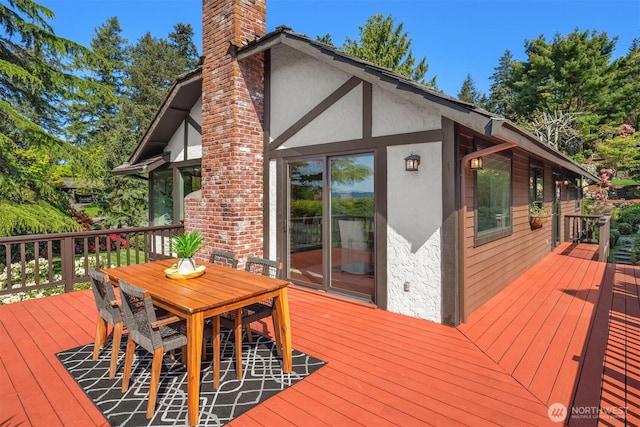 wooden deck with outdoor dining area