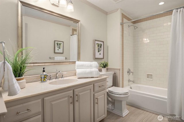 full bath with vanity, shower / bath combo with shower curtain, toilet, recessed lighting, and ornamental molding