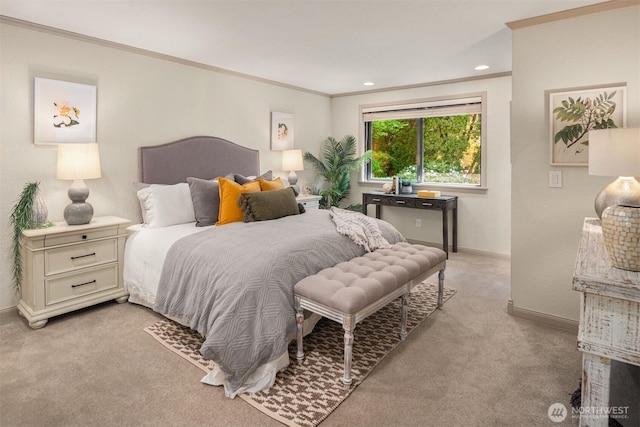 bedroom featuring crown molding, baseboards, and light colored carpet