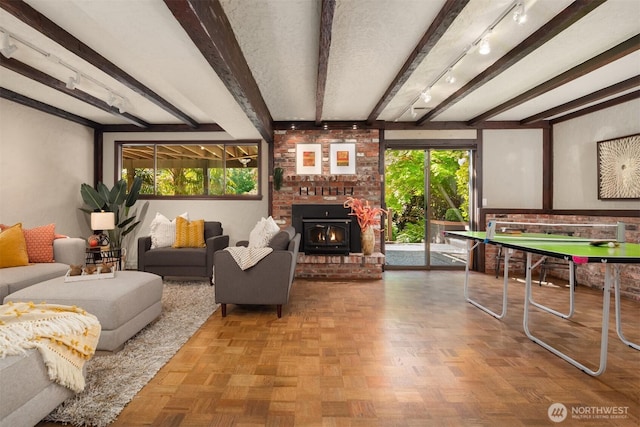 living area featuring beamed ceiling