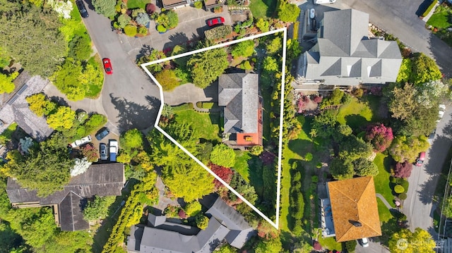 birds eye view of property with a residential view