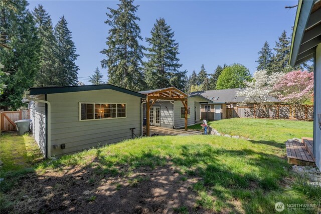 6160 NE 185th St, Kenmore, WA 98028 - rear view of house featuring french doors, a pergola, and an outbuilding