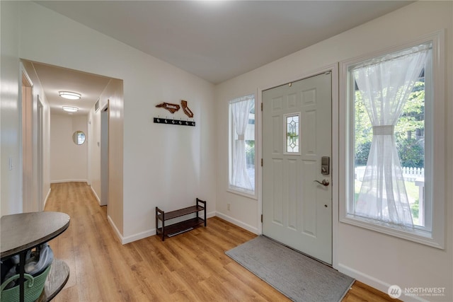 6160 NE 185th St, Kenmore, WA 98028 - foyer featuring light wood-style floors and baseboards