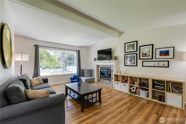 6160 NE 185th St, Kenmore, WA 98028 - living area with a fireplace, wood finished floors, and baseboards