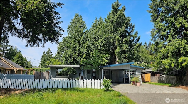6160 NE 185th St, Kenmore, WA 98028 - view of front facade featuring driveway, an attached carport, and a fenced front yard