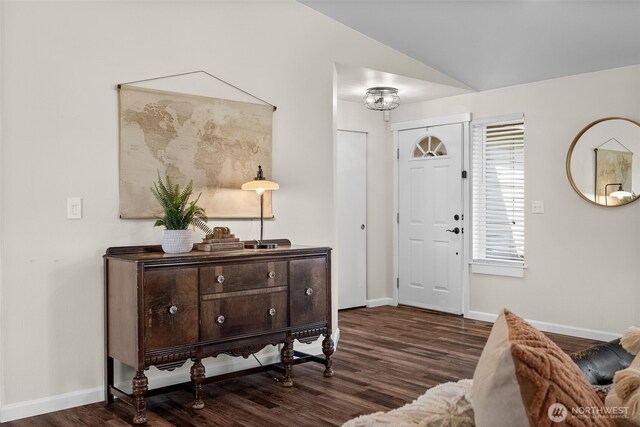 entrance foyer with baseboards, vaulted ceiling, and dark wood-style flooring