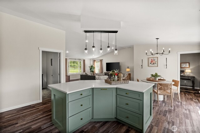 kitchen with light countertops, dark wood-style flooring, vaulted ceiling, and green cabinets