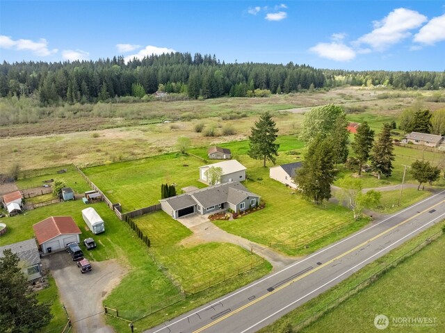 bird's eye view with a wooded view