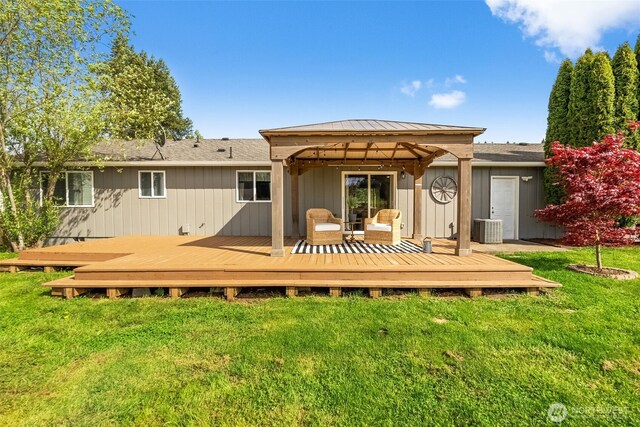 back of house with a lawn, a gazebo, cooling unit, and a deck
