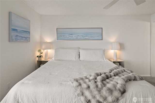 bedroom featuring carpet, a textured ceiling, and ceiling fan