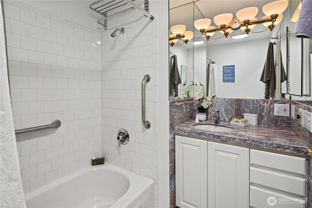 full bath featuring shower / tub combo with curtain, vanity, and a chandelier