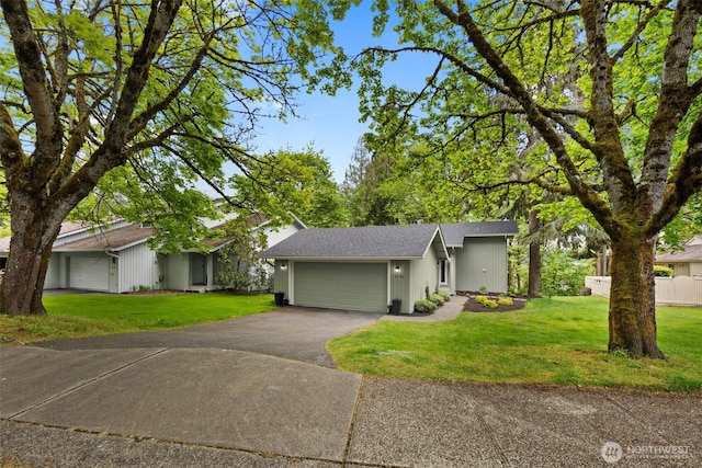 6540 159th Ave NE, Redmond, WA 98052 - view of front facade with roof with shingles, an attached garage, driveway, and a front lawn