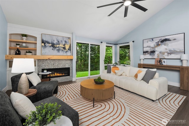6540 159th Ave NE, Redmond, WA 98052 - living area featuring ceiling fan, vaulted ceiling, wood finished floors, a tile fireplace, and baseboards