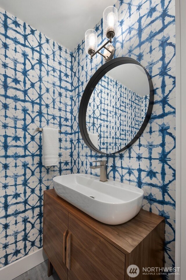 6540 159th Ave NE, Redmond, WA 98052 - bathroom featuring wallpapered walls and vanity