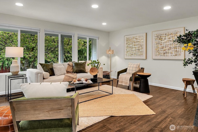 living area featuring recessed lighting, baseboards, and dark wood finished floors