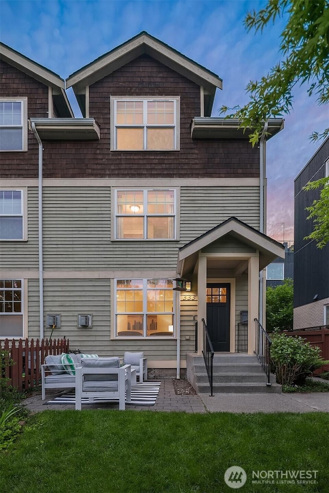back of house featuring outdoor lounge area