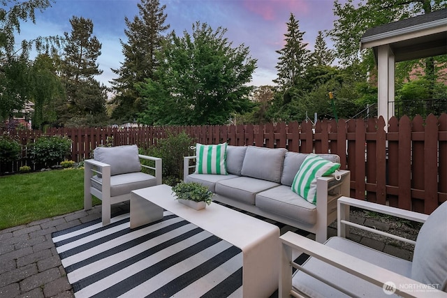 view of patio with an outdoor living space and a fenced backyard