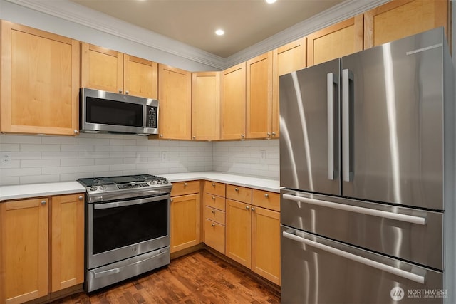 kitchen with stainless steel appliances, light countertops, backsplash, crown molding, and light brown cabinets