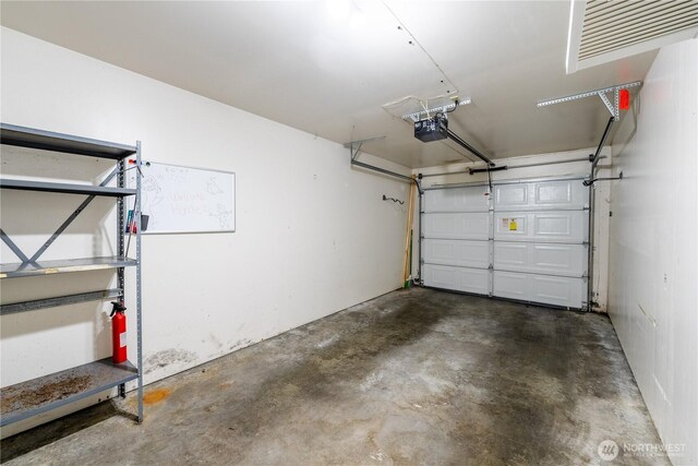 garage featuring a garage door opener
