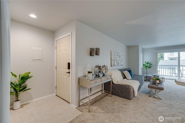 carpeted living room featuring recessed lighting and baseboards