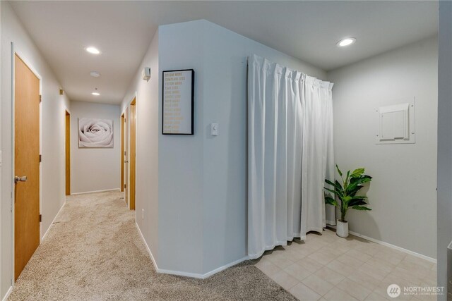 corridor featuring recessed lighting and baseboards