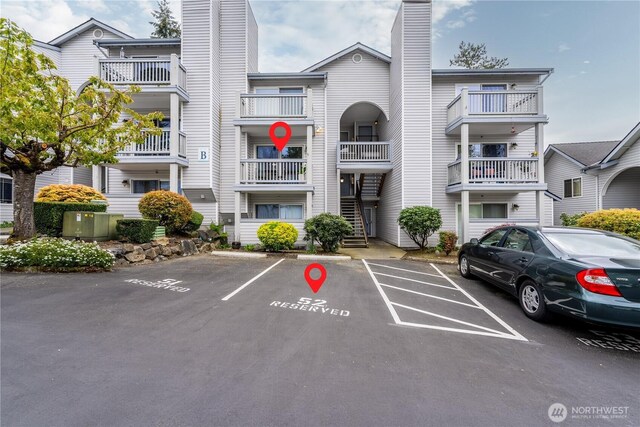 view of property with uncovered parking