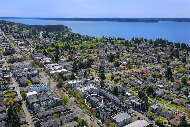 bird's eye view featuring a residential view and a water view