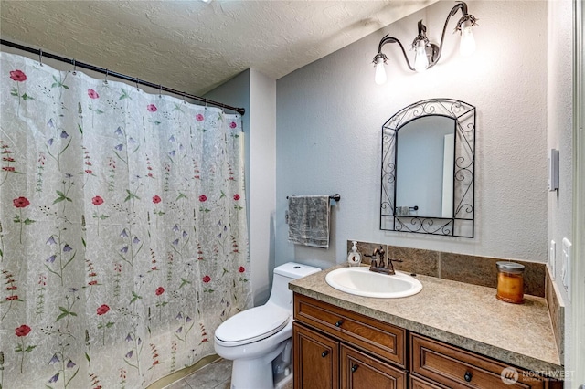 bathroom with toilet, a textured ceiling, a shower with curtain, and vanity