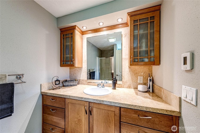 full bath featuring vanity and a stall shower