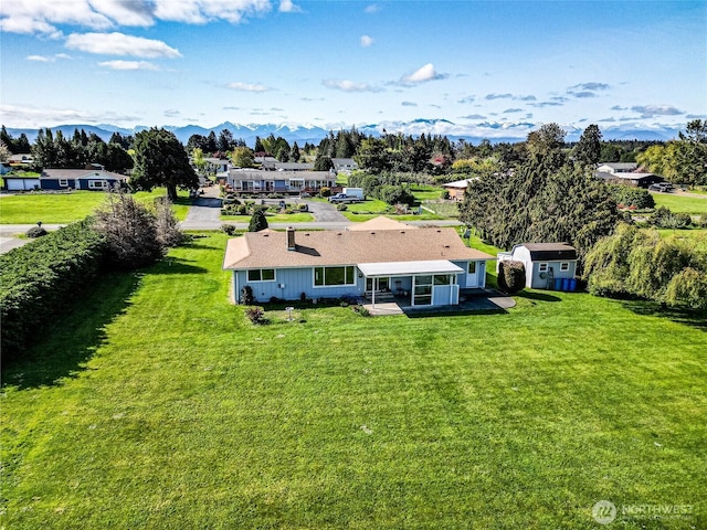 birds eye view of property with a residential view and a mountain view