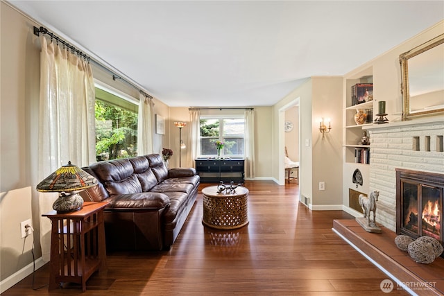 15825 10th Ave SW, Burien, WA 98166 - living room with plenty of natural light, hardwood / wood-style floors, built in features, and baseboards