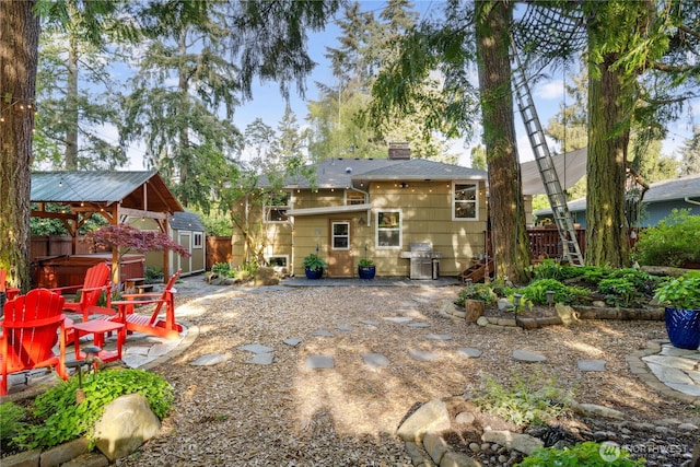15825 10th Ave SW, Burien, WA 98166 - back of house with a hot tub, a chimney, a patio, and a gazebo