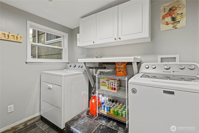 15825 10th Ave SW, Burien, WA 98166 - laundry area with washer and dryer, cabinet space, baseboards, and dark stone finish floors