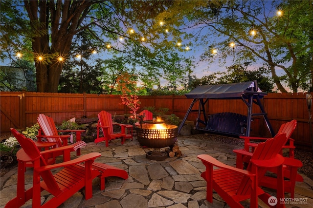 15825 10th Ave SW, Burien, WA 98166 - fenced backyard featuring an outdoor fire pit and a patio area