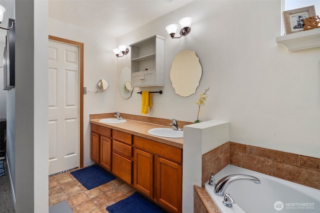 bathroom featuring a garden tub, a sink, and double vanity