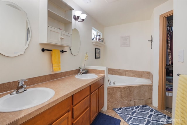 full bathroom with a sink, double vanity, a bath, and a spacious closet