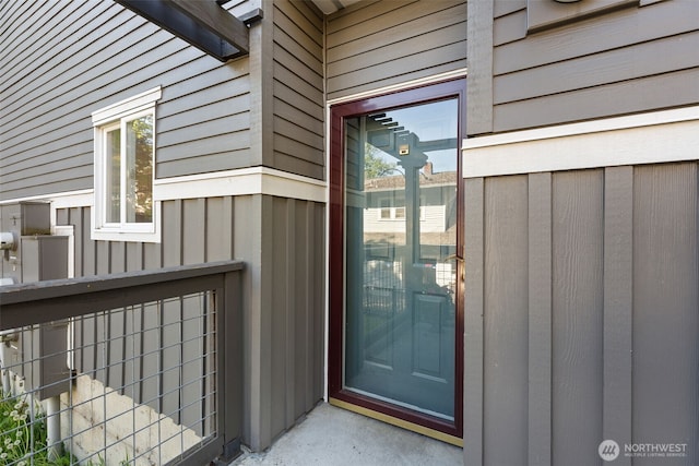 doorway to property with board and batten siding